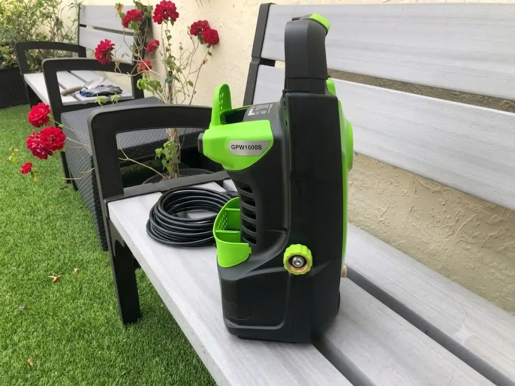 Greenworks 1600 PSI Pressure Washer horizontal chassis on ground during vehicle detailing